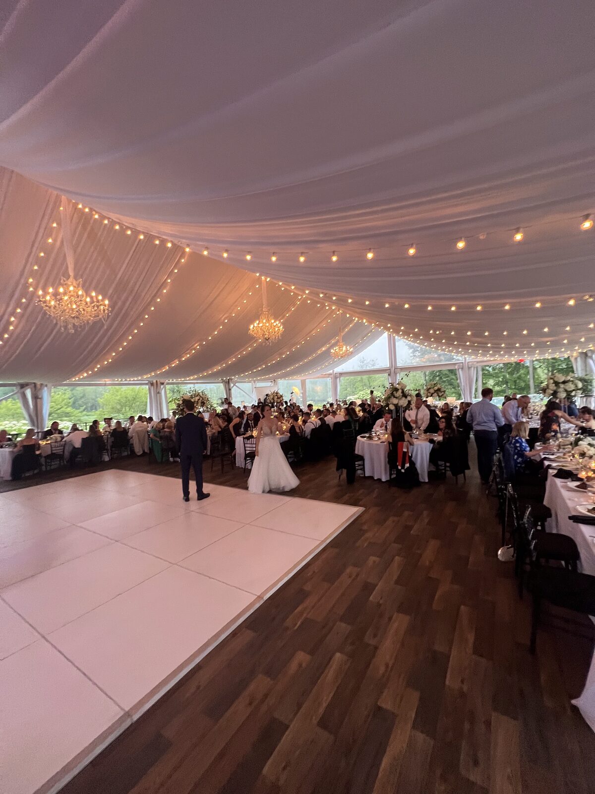 Elegant tented wedding reception with string lights, DJ Glaze Entertainment