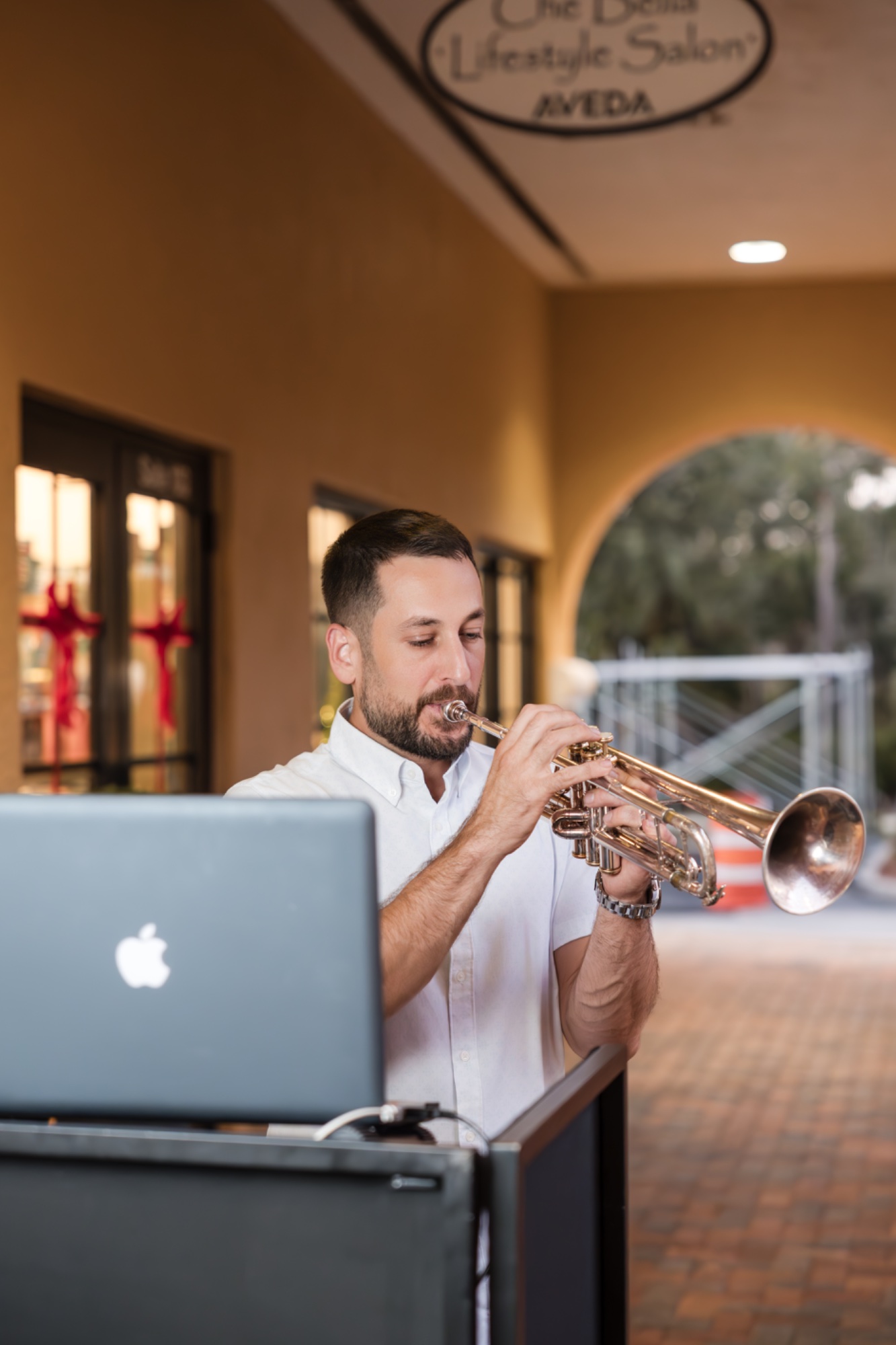 DJ Glaze playing live trumpet at an event